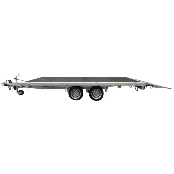 Side view of a Variant 3542 UX Universal Tilting Flatbed Trailer without sides